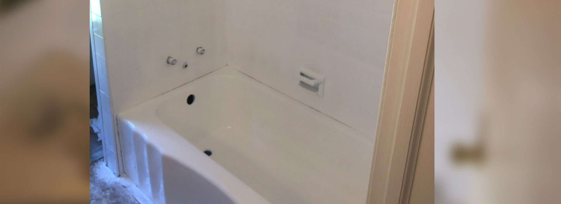 A bathroom with a bathtub and a toilet.