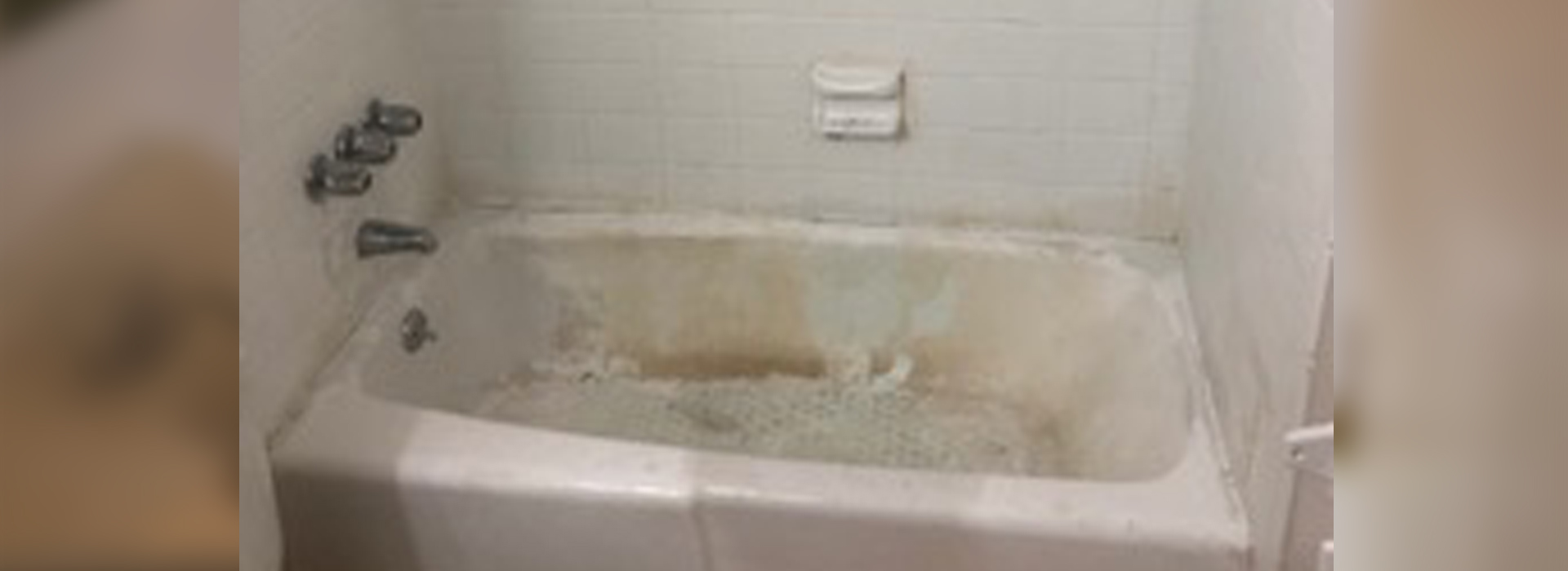 A bathroom with a bathtub and a sink.