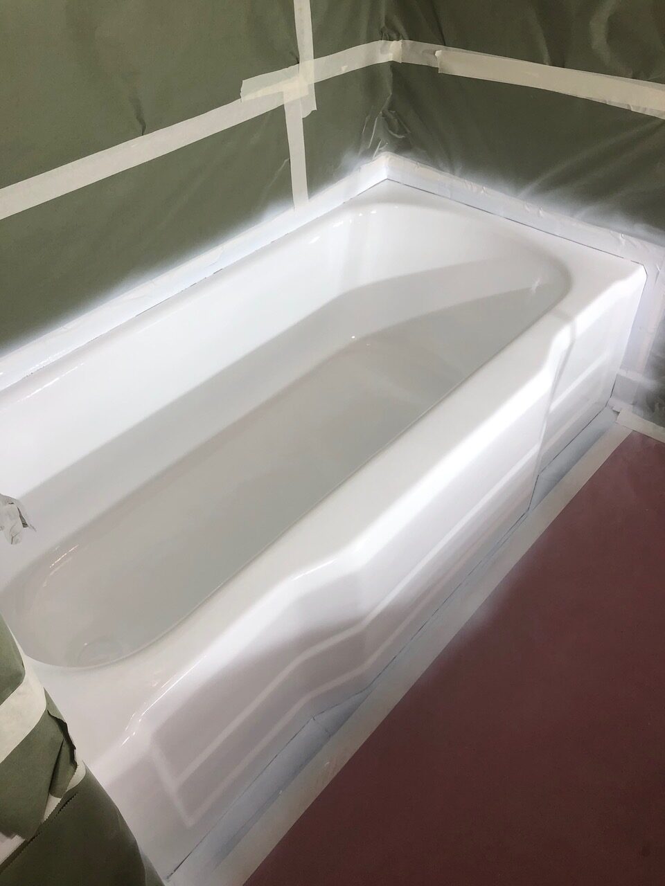 A bathtub that is sitting in the middle of a room.